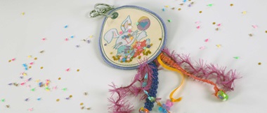 Embroidered pastel in-the-hoop Easter bunny bag tag