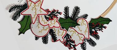 Christmas wreath made of Christmas embroidery silhouettes.