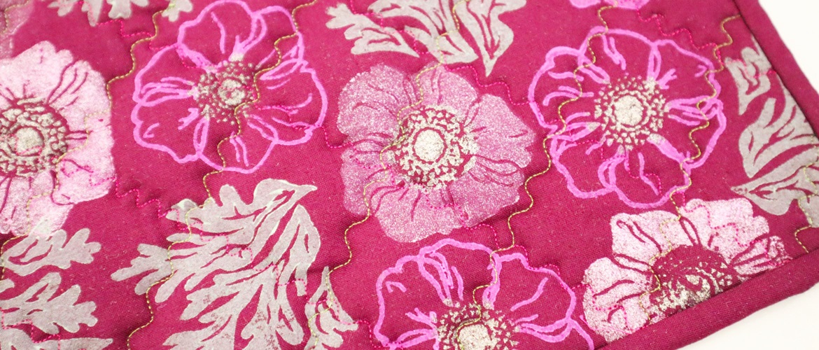 Pink floral block printed quilted trivet close up
