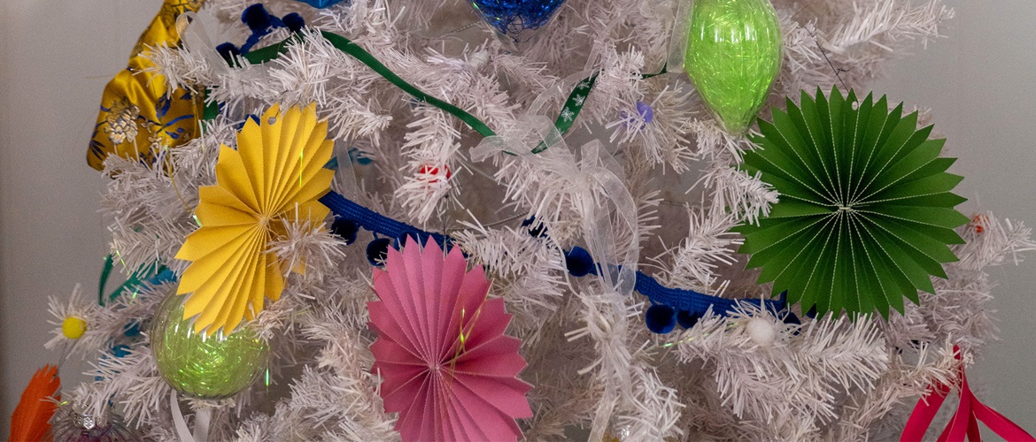 Folded paper stars in a white christmas tree