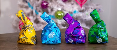 4 japanese mini knot bags on a table