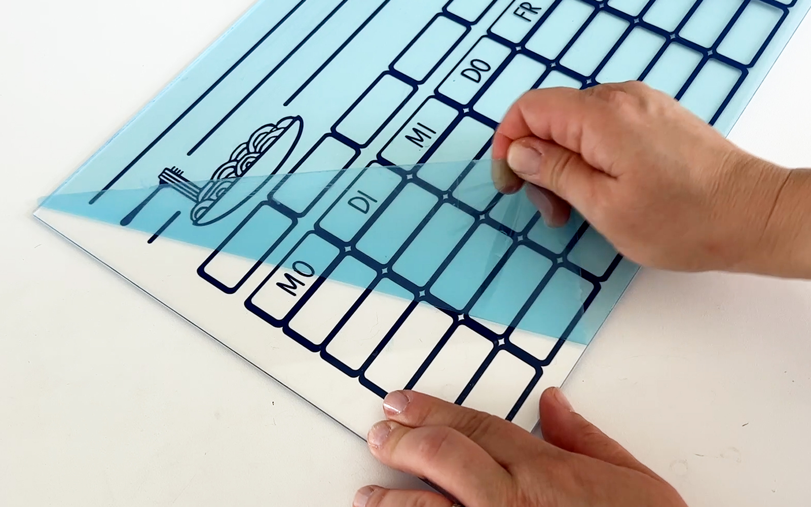 removing blue transfer film from acrylic weekly planner