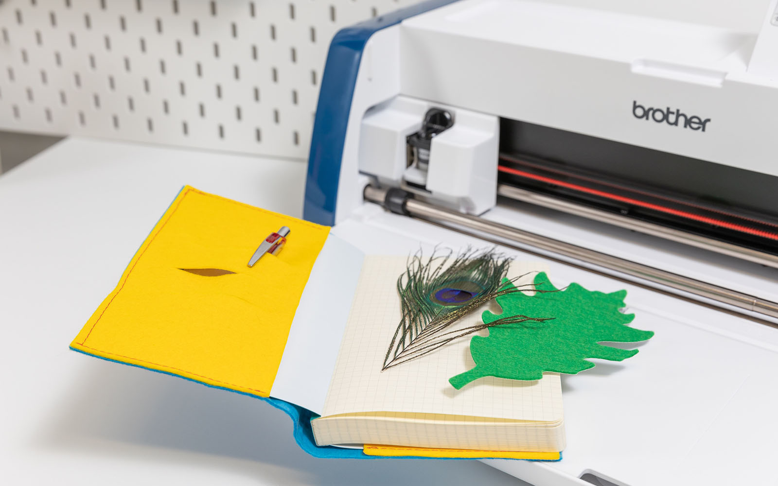 Adventure diary open to front page with leaf bookmark and ScanNCut