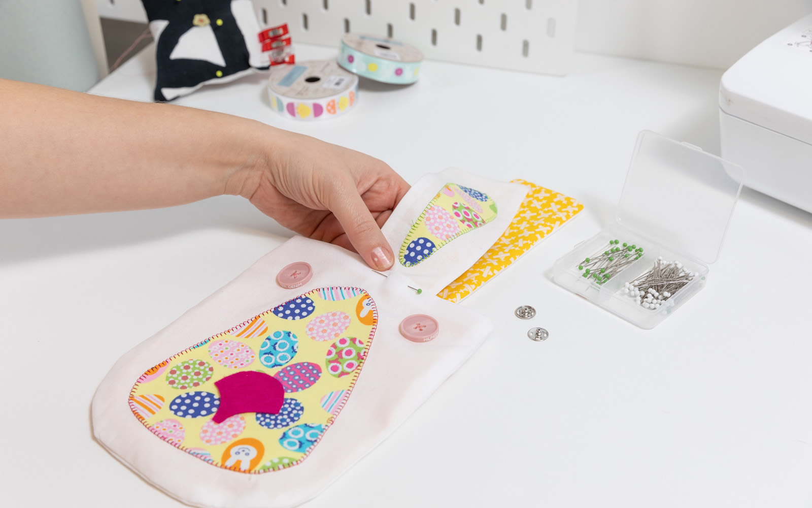 hand pinning strap to Easter bunny bag