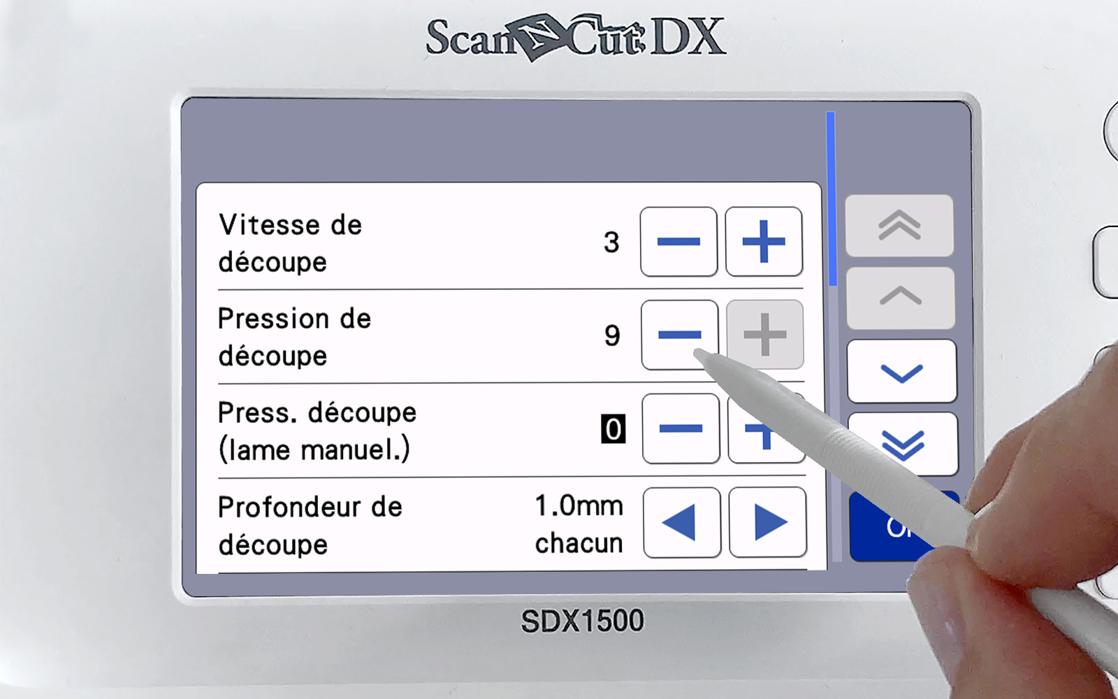 hand with stylus changing cutting pressure on Brother ScanNCut screen