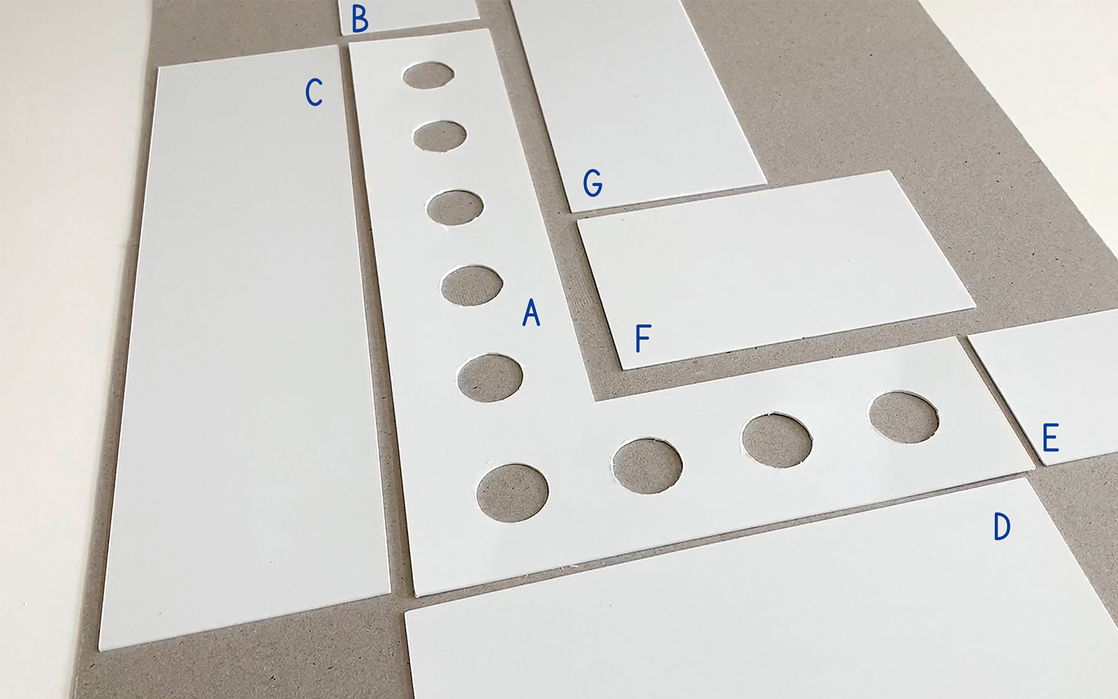 multiple pieces of cut white flat polystyrene laid out