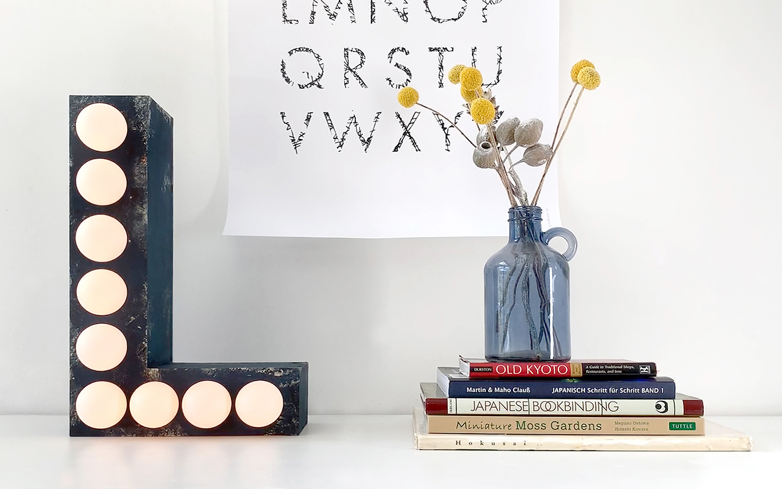 Black L shaped 3D lamp with white bulbs and Brother ScanNCut
