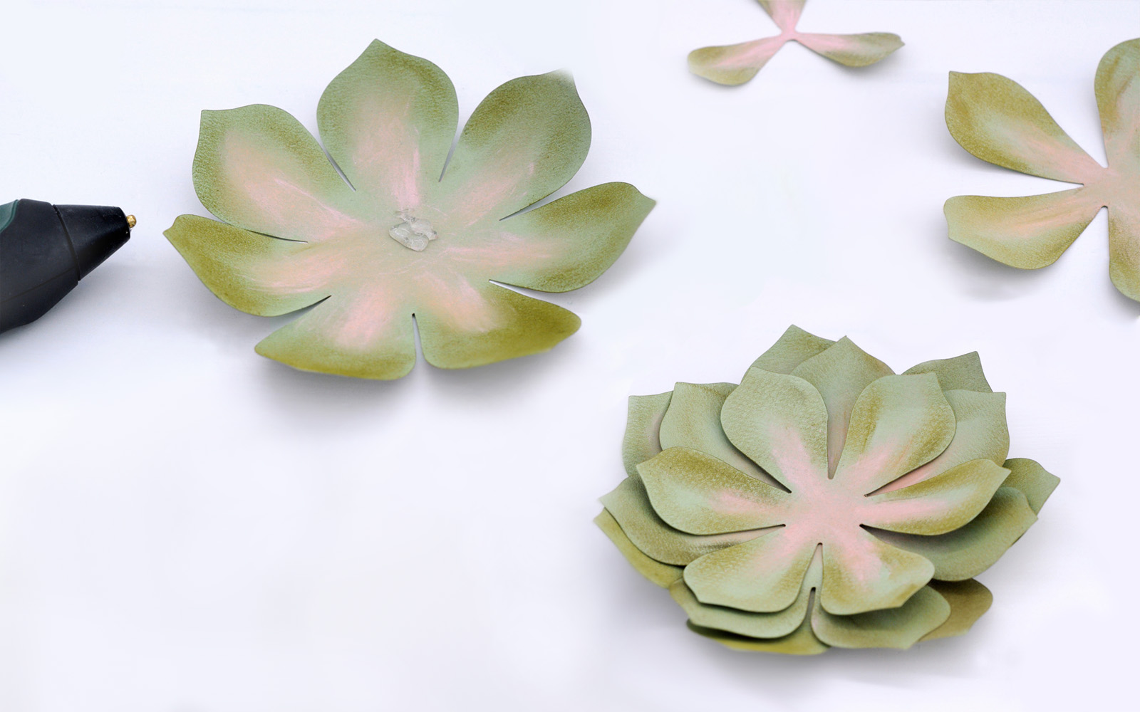 Paper succulent leafs painted and ready to be glued together