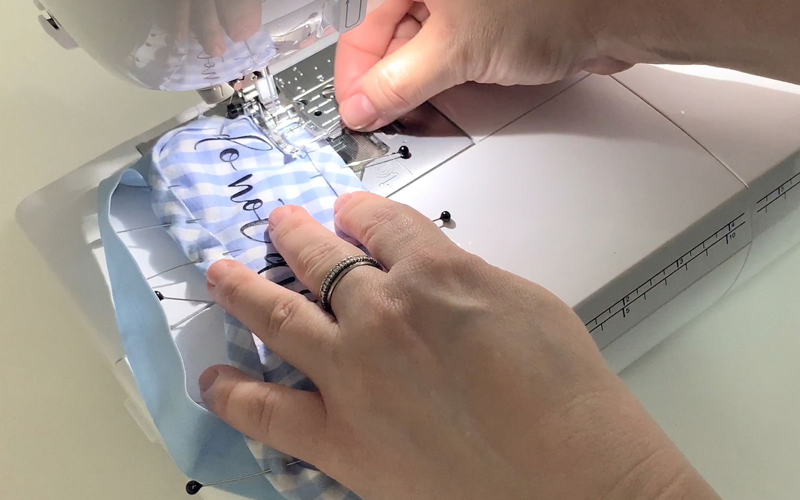 Sewing a light blue check sleeping mask on a Brother sewing machine