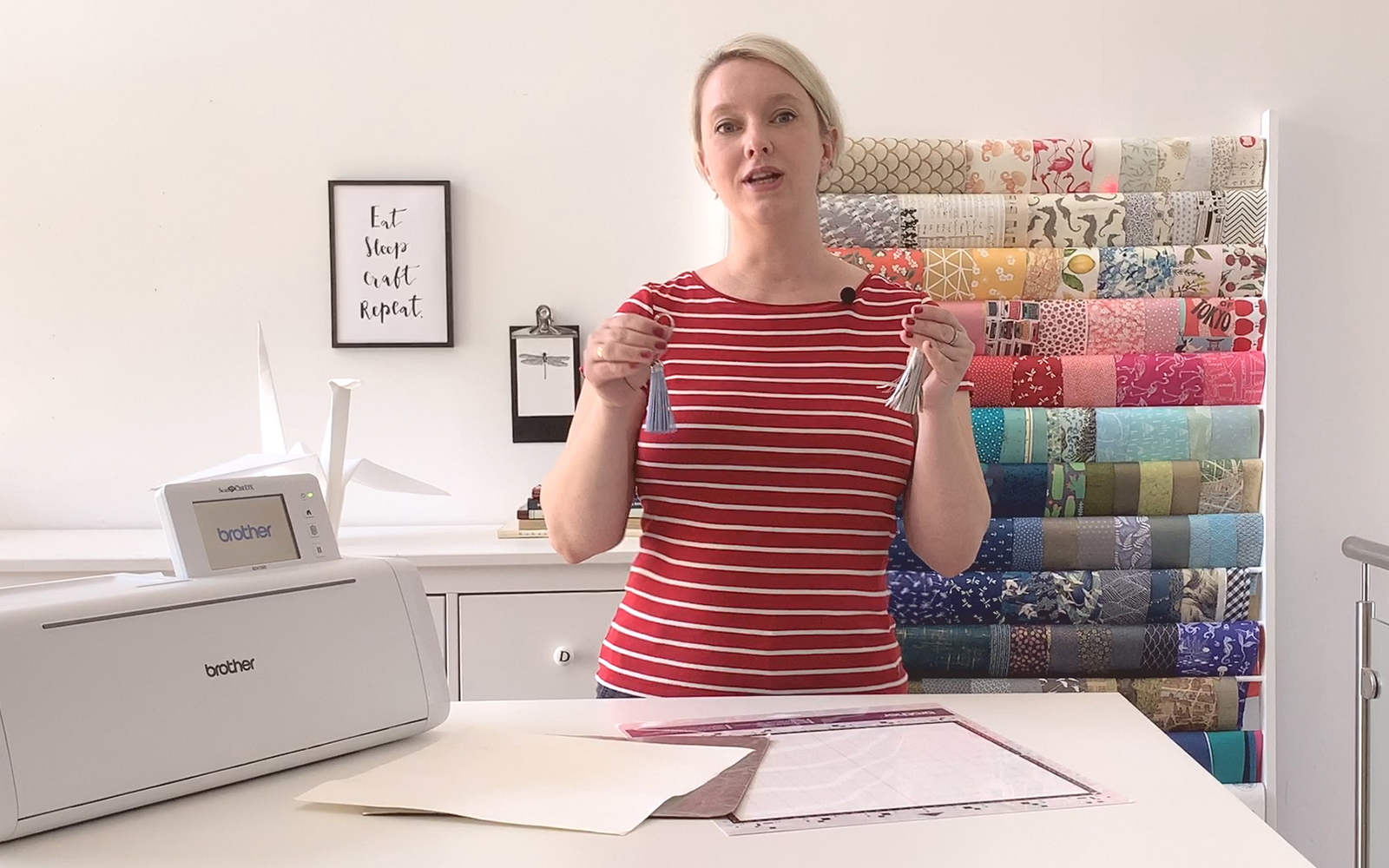 woman in red and white striped top standing behind Brother ScanNcut