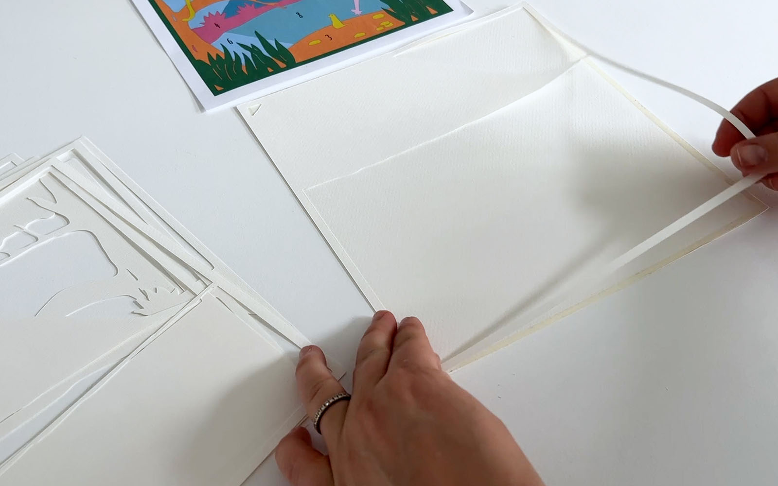 Lightbox cutout layers being glued together