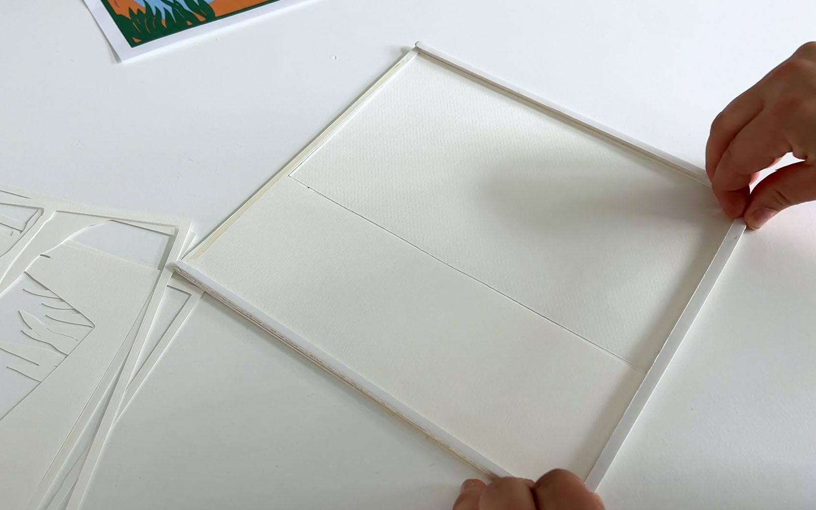 Foam board strips added between layers of card to make a lightbox