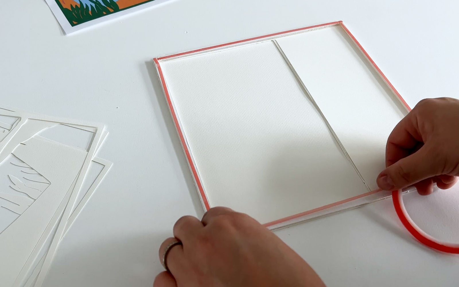 Double-sided tape being added to foam strips