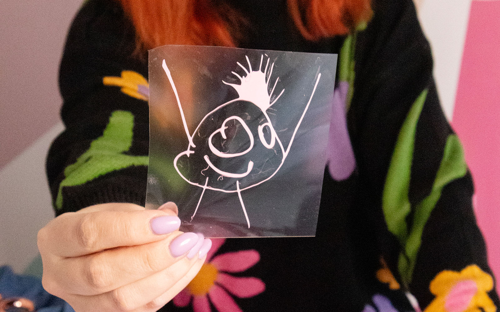 woman holding out ScanNCut HTV doodle