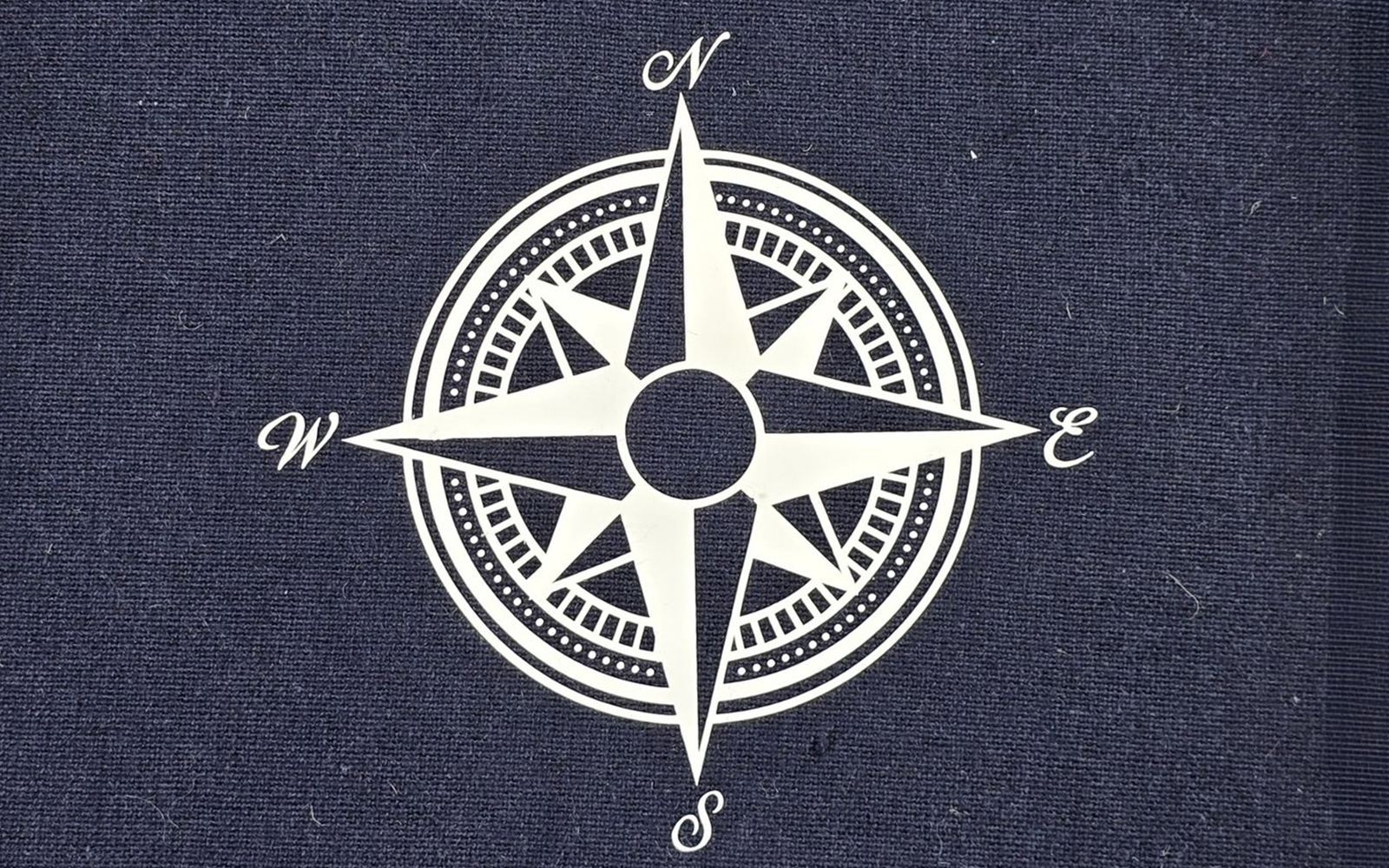 White nautical compass cut from heat transfer vinyl with Brother ScanNCut