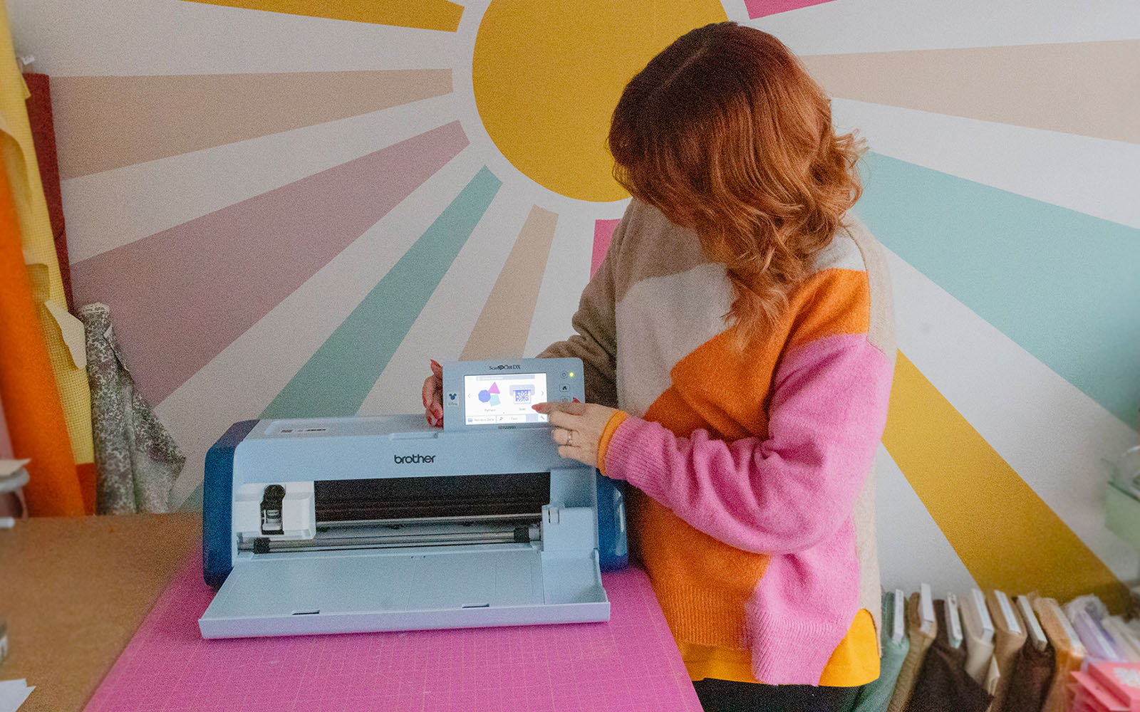 woman touching ScanNCut SDX2250D screen