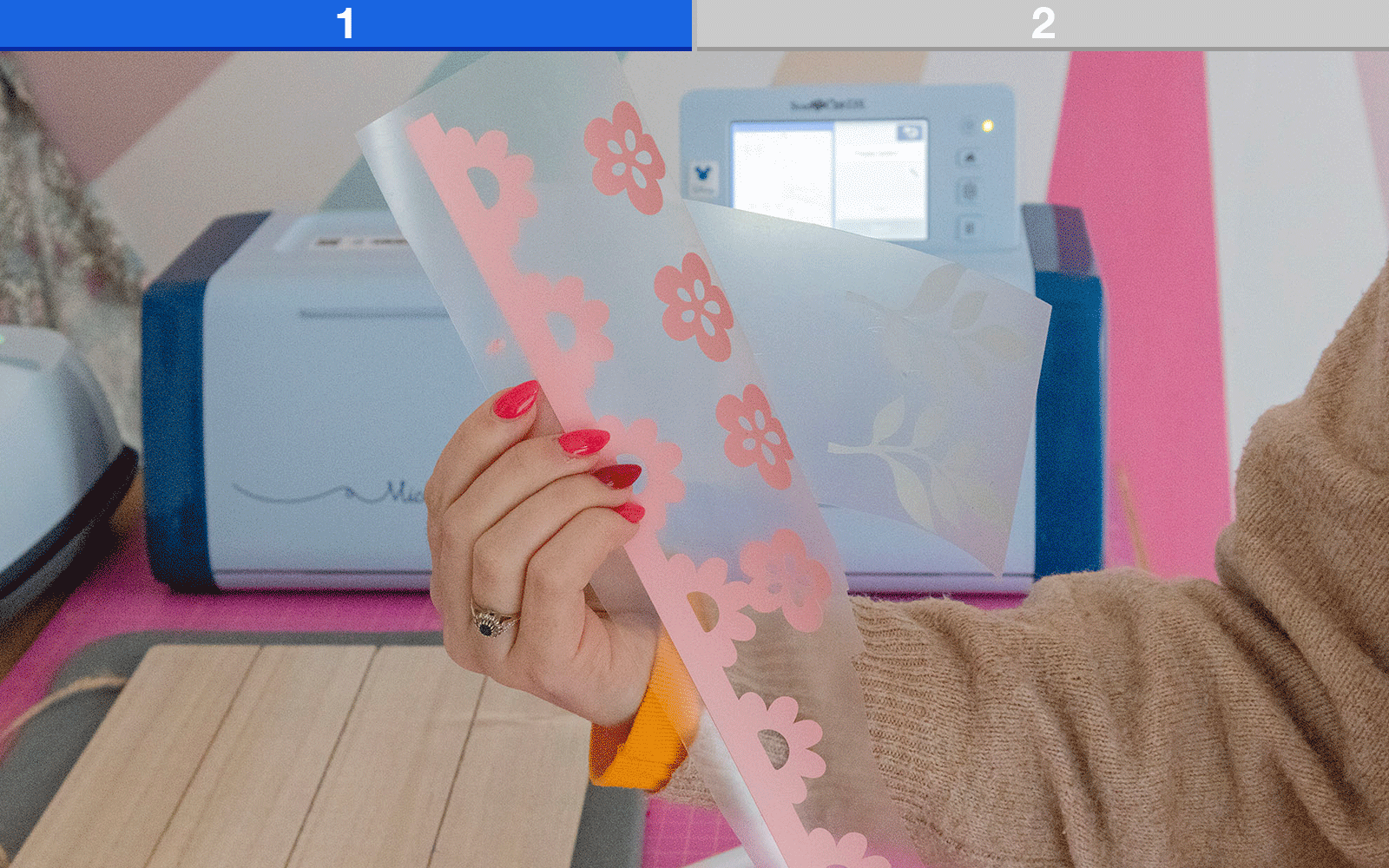 Hands holding pink HTV and wooden sign with ‘Sweet Dreams’ text 