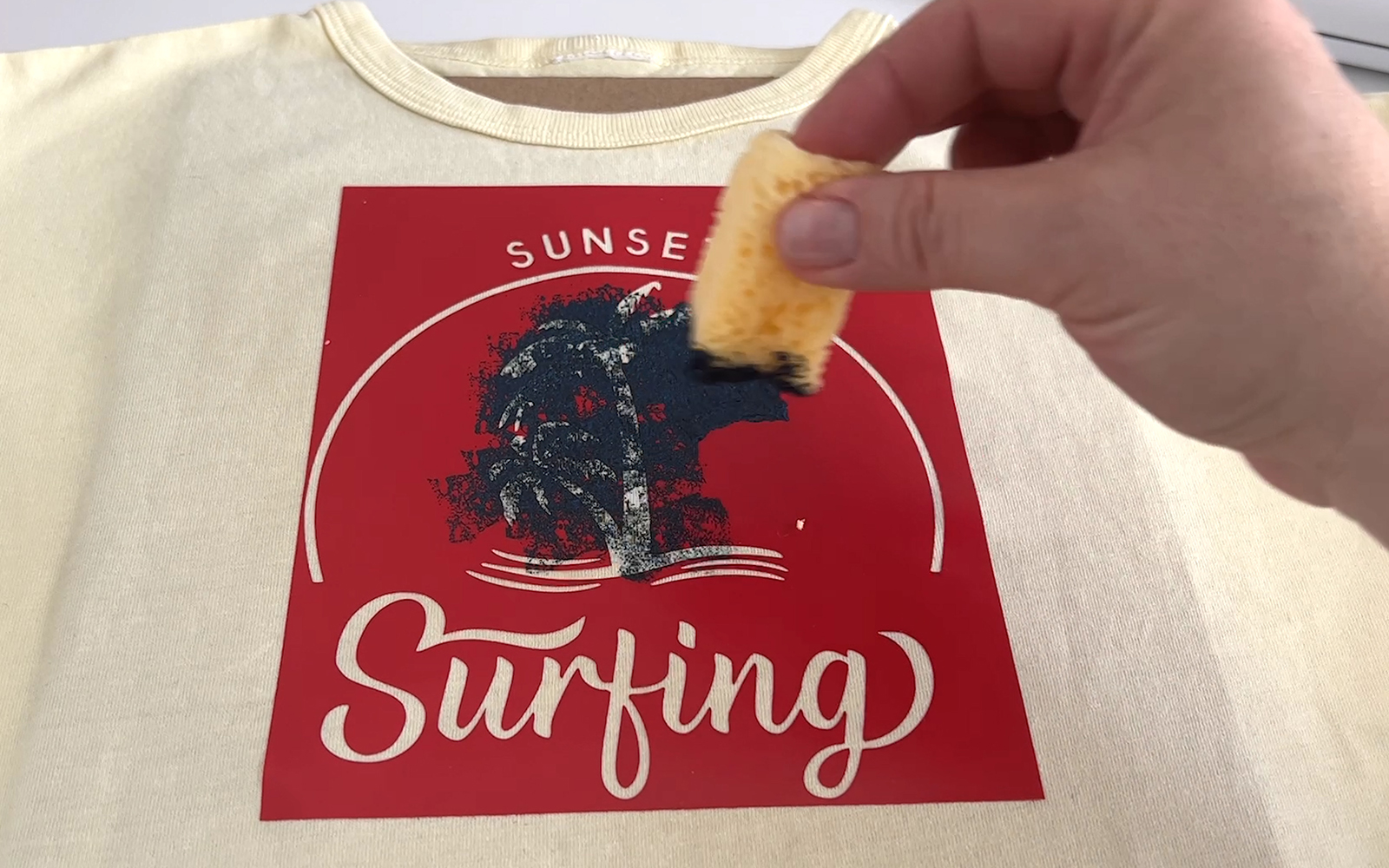 Paint being applied to surfing stencil