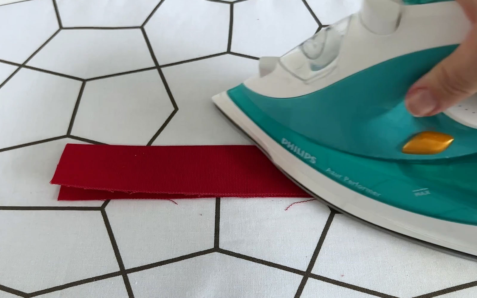 Folded red fabric ironed in half