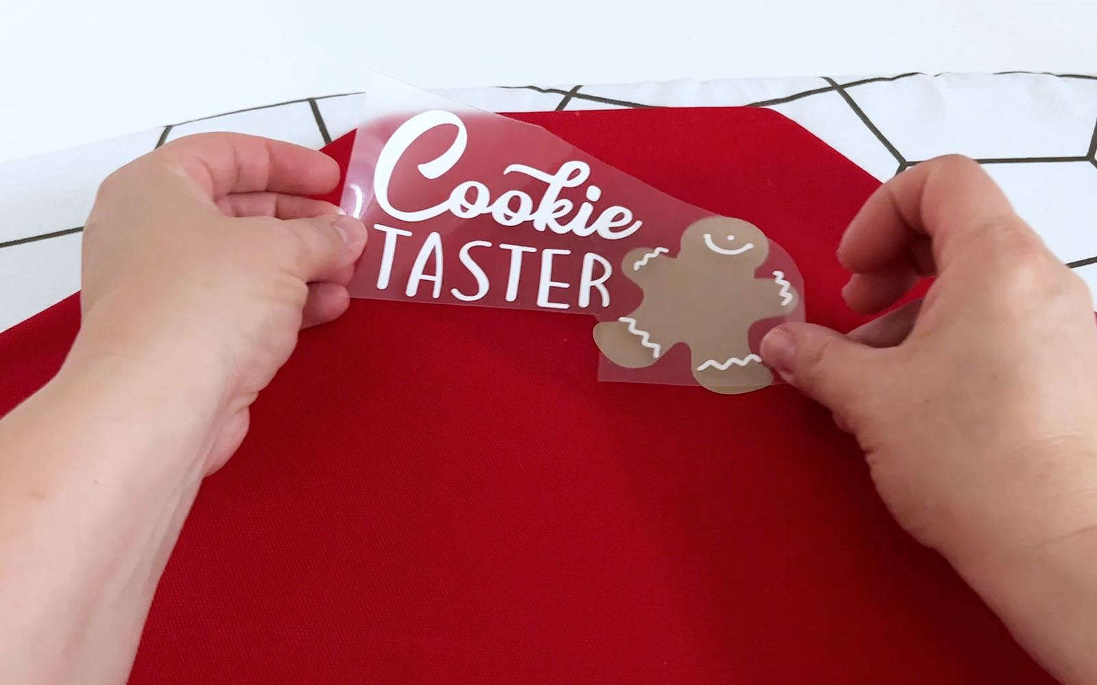 Placing white vinyl layer on top of gingerbread man