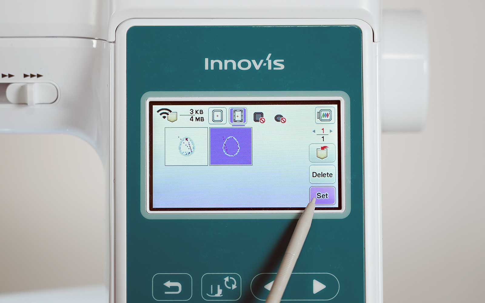 stylus pointing to Brother Innov-is embroidery machine screen