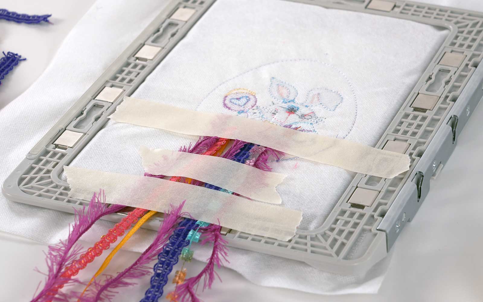 Ribbons taped to the wrong side of Brother magnetic embroidery frame