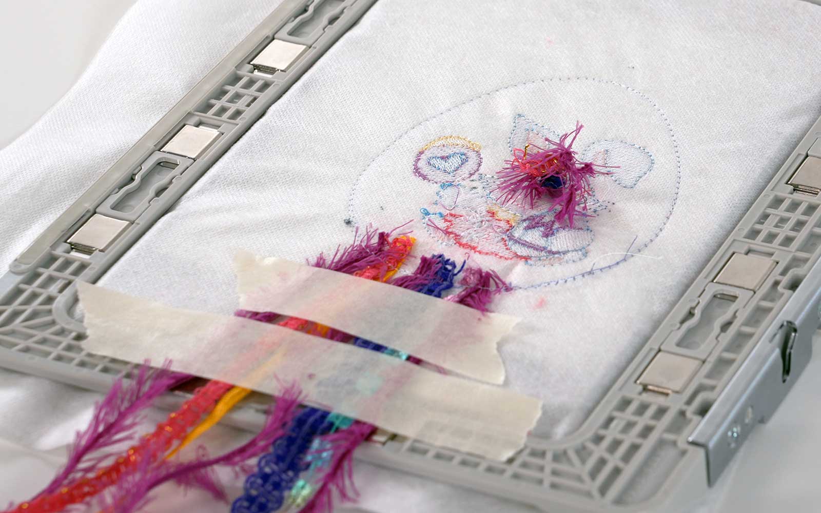 Ribbon ends trimmed on wrong side of embroidery frame