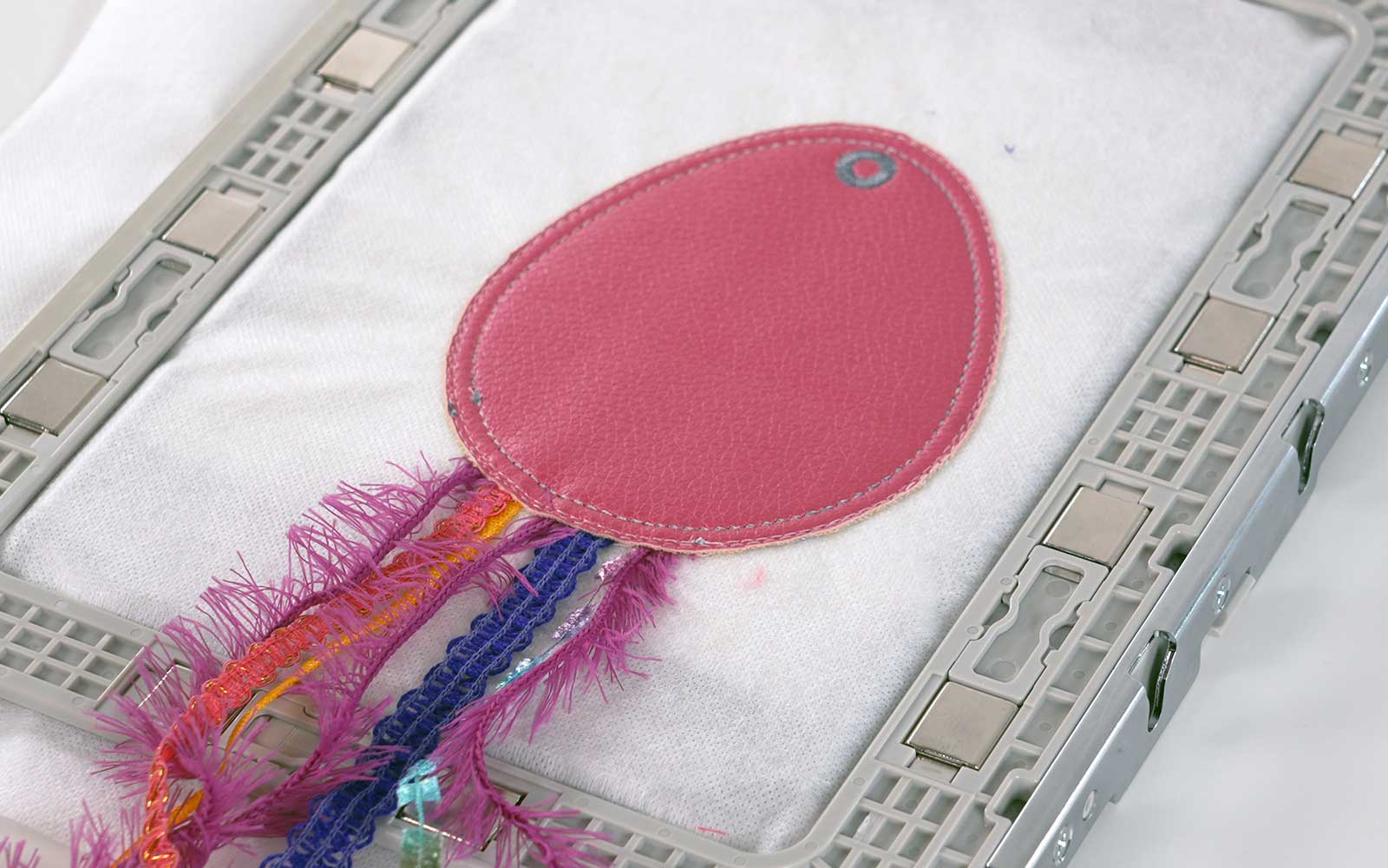 Pink Easter egg bag tag with ribbon in Brother embroidery frame