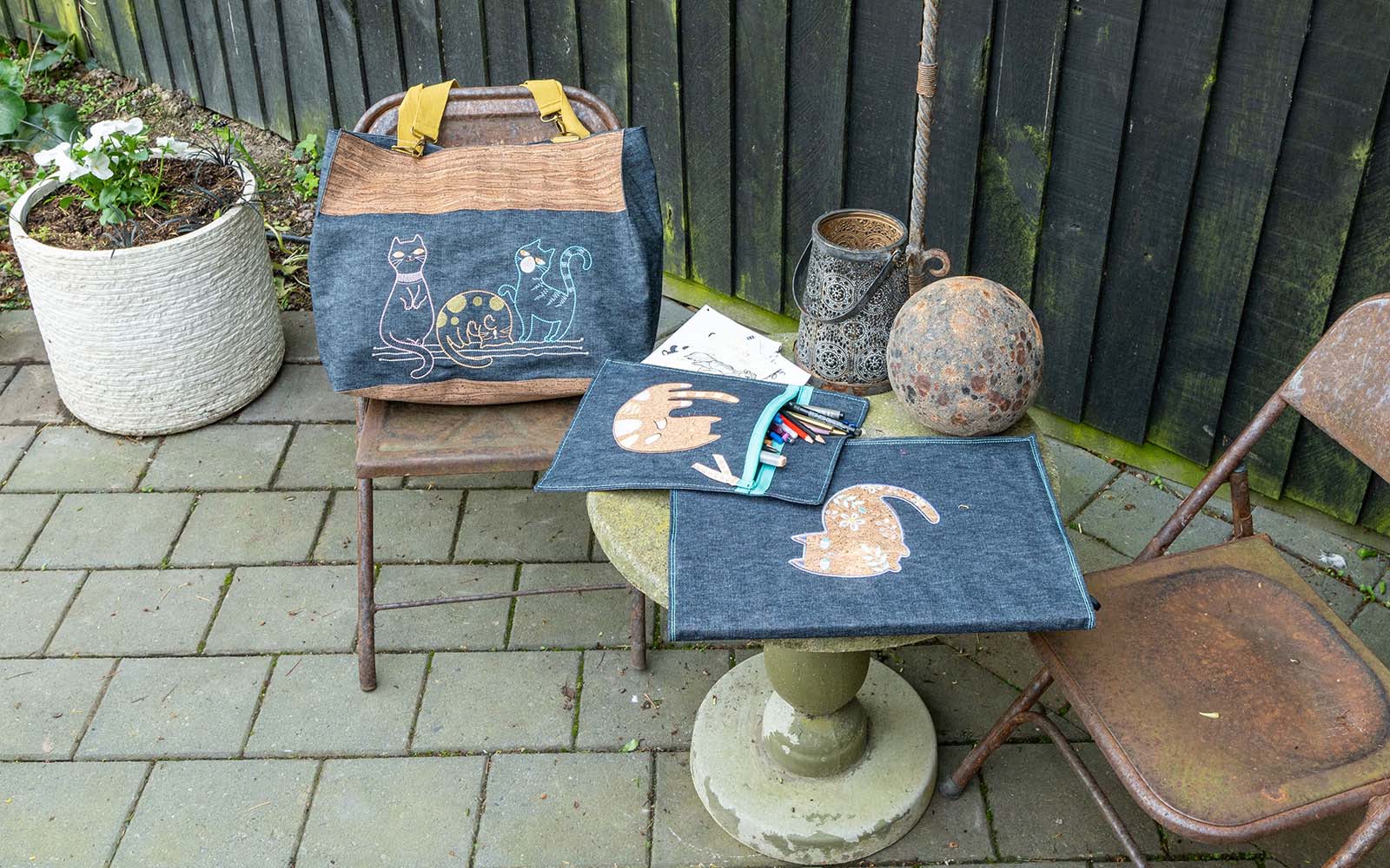 cork cartoon cats embroidered onto Demin book cover, bag, pencil case