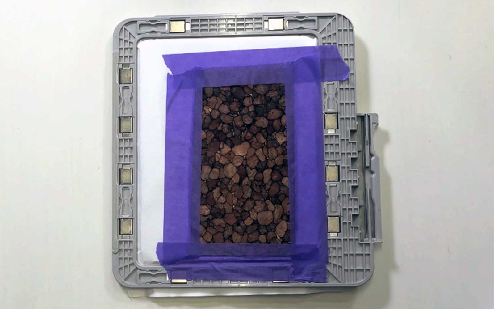 Embroidery frame with cork fabric and purple tape