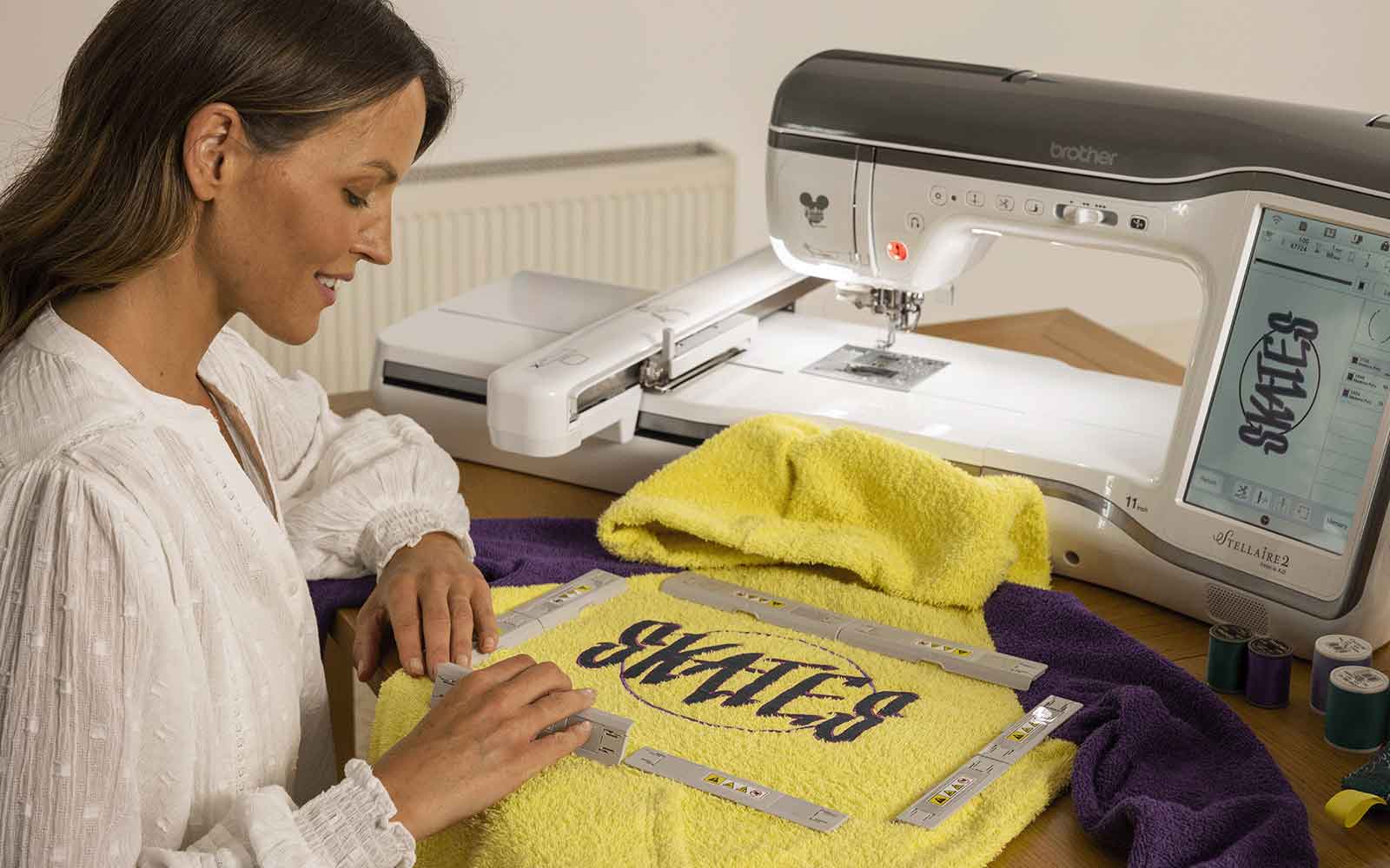 A lady hooping her Brother machine embroidery project, an essential step for achieving great results.
