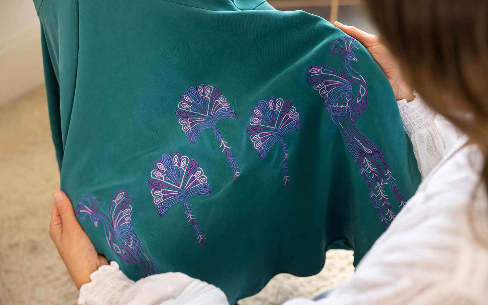 Close-up of an embroidered fabric project, showcasing intricate stitching