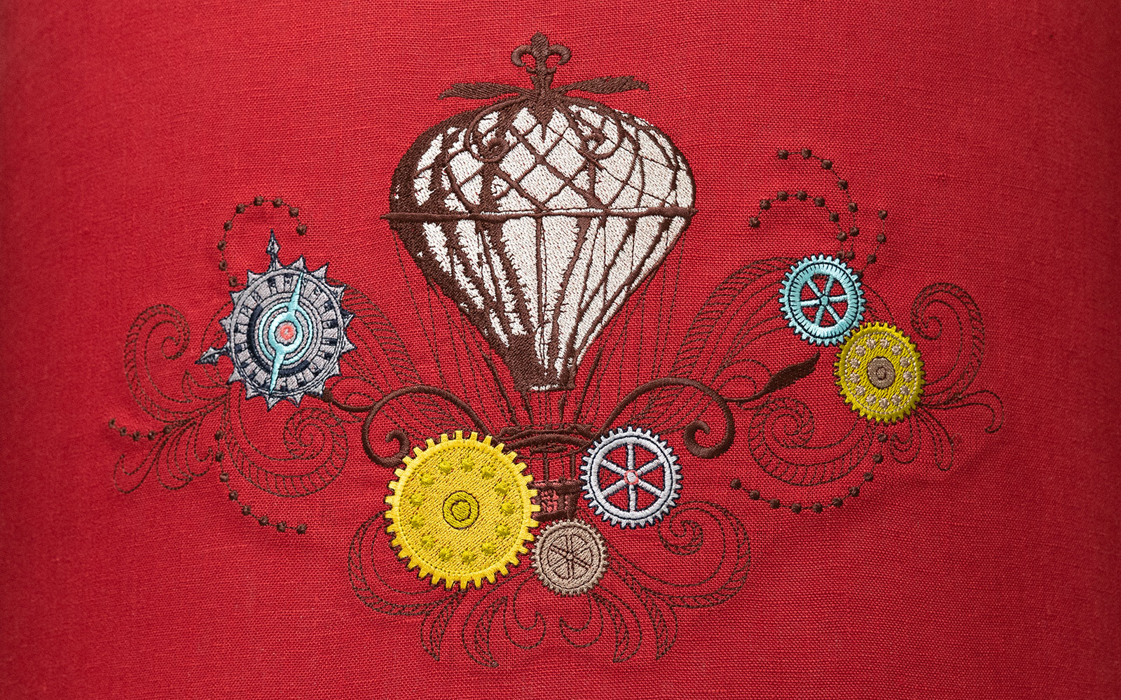 embroidered steampunk hot air balloon with cogs and gears on red