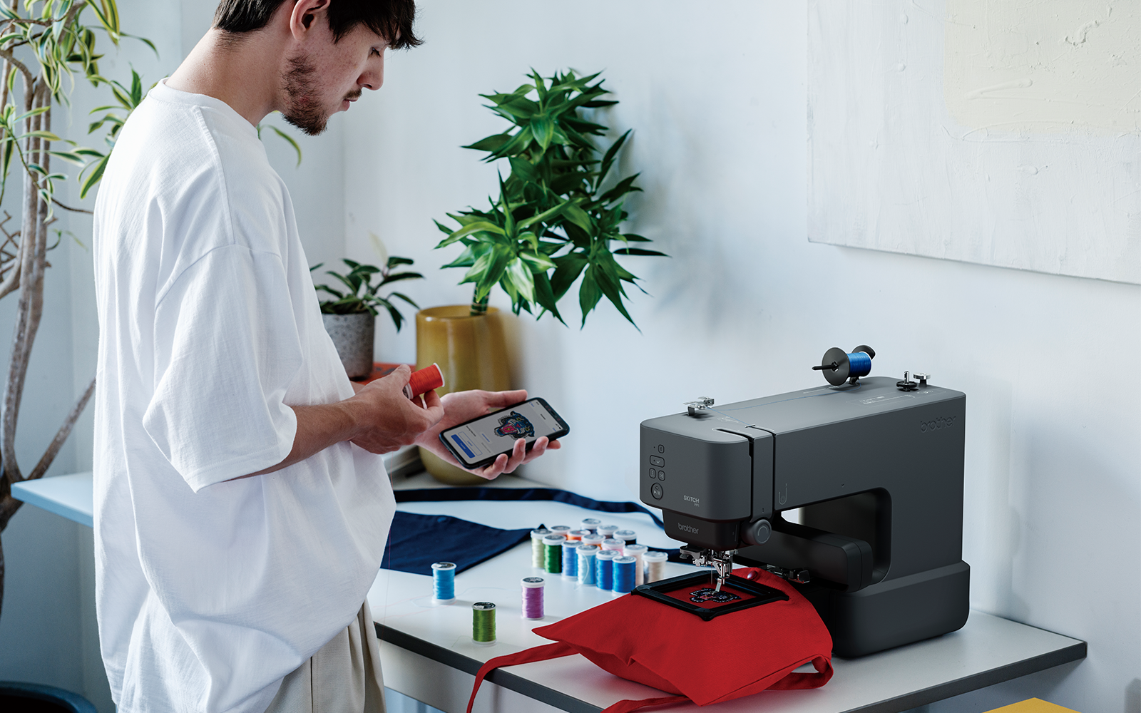 man sends embroidery design to Brother PP1 from mobile