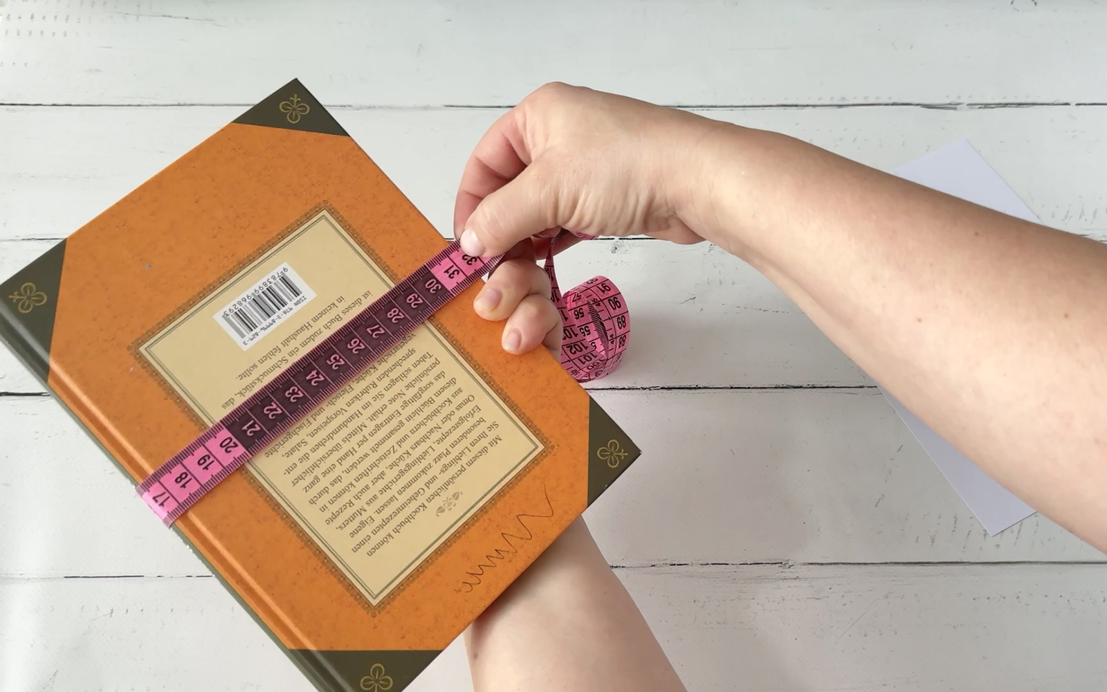 Measuring book with tape measure