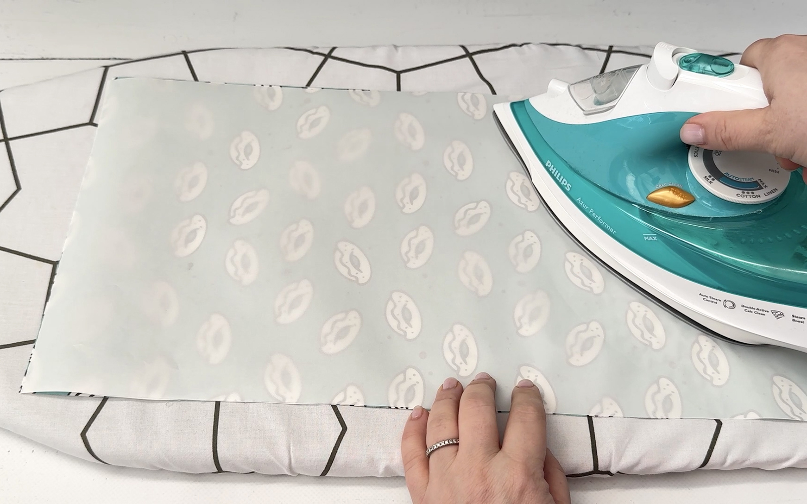 Ironing laminate sheet onto PrintModa Studio printed fabric.