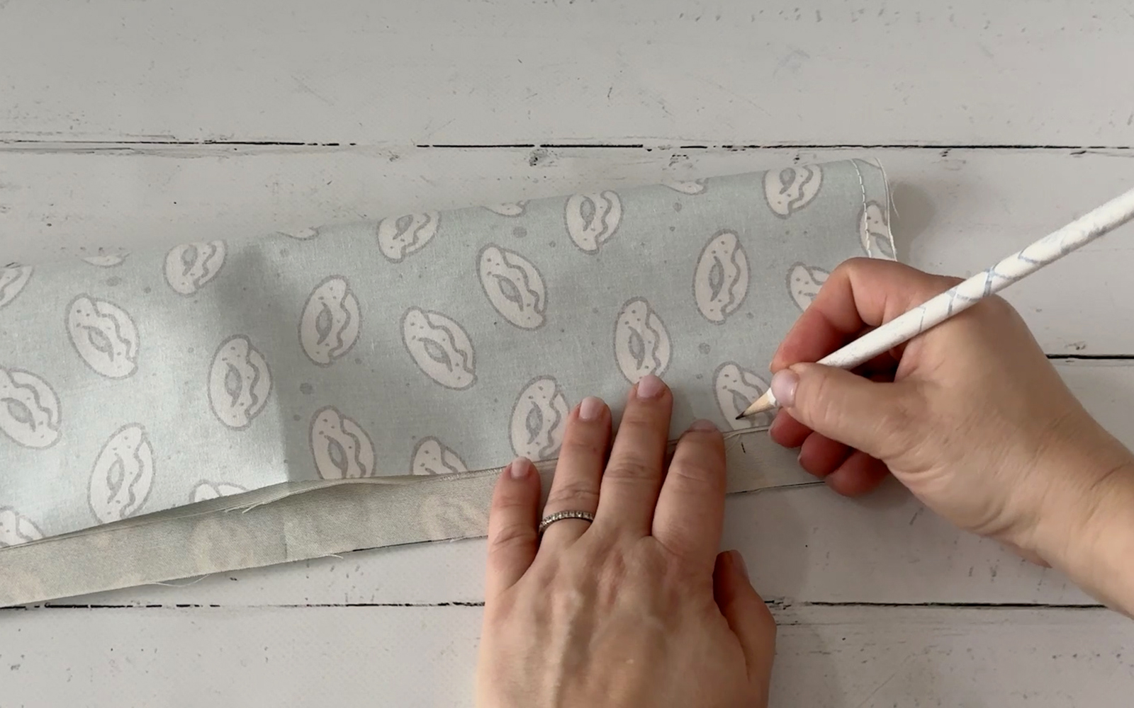 Marking fold lines with pencil.