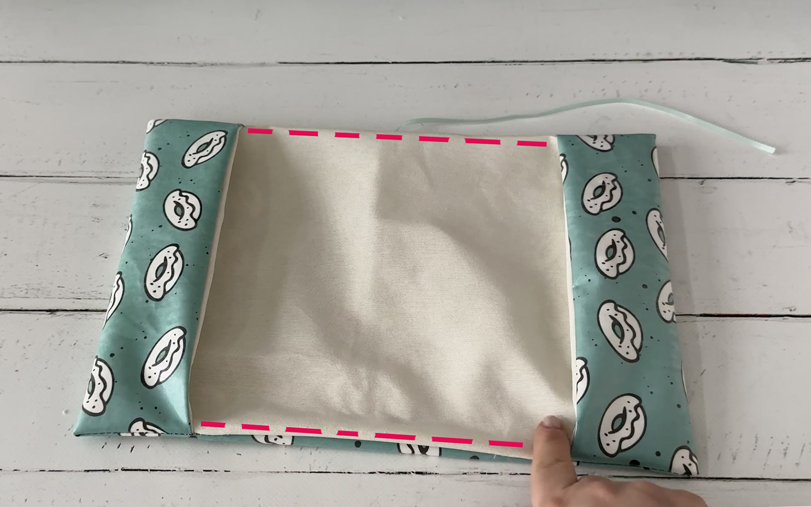 fabric book cover lying open on table
