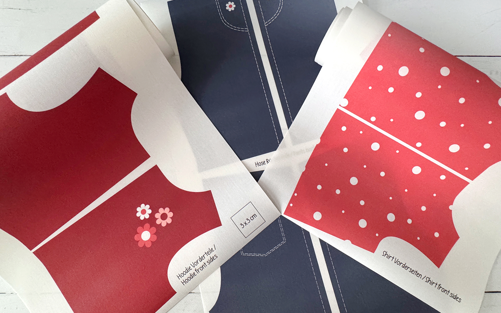 Printed pattern pieces for doll’s wardrobe.