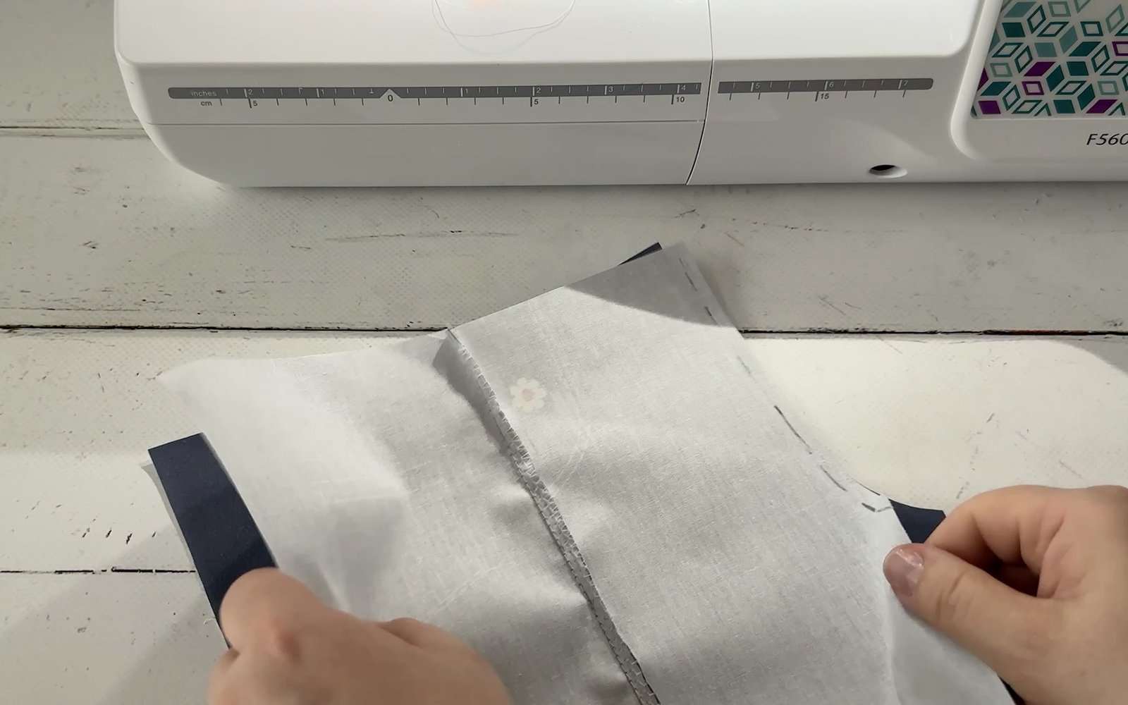 Doll’s pants piece being sewn on Brother sewing machine