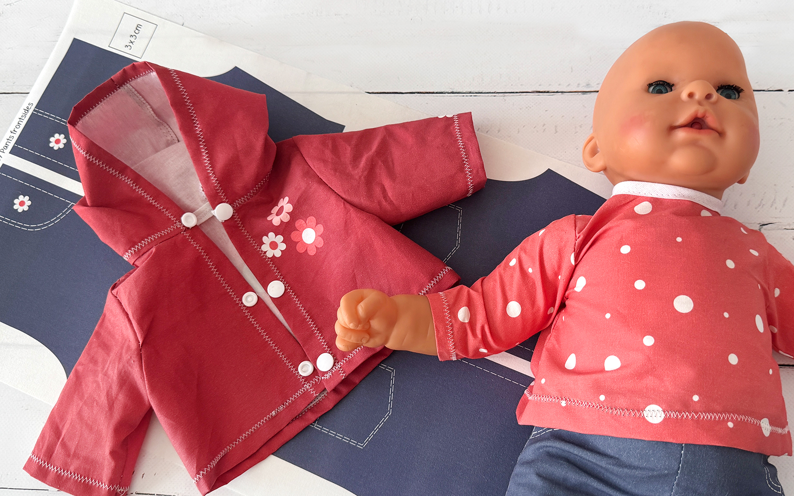 Doll’s wardrobe with completed shirt on doll.