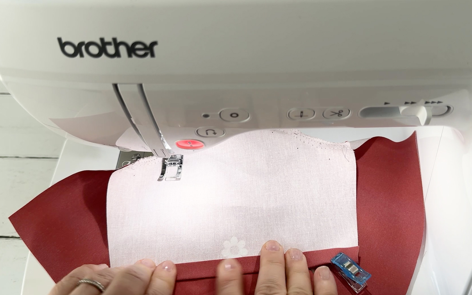 Sewing sleeves hems on doll’s jacket with Brother sewing machine