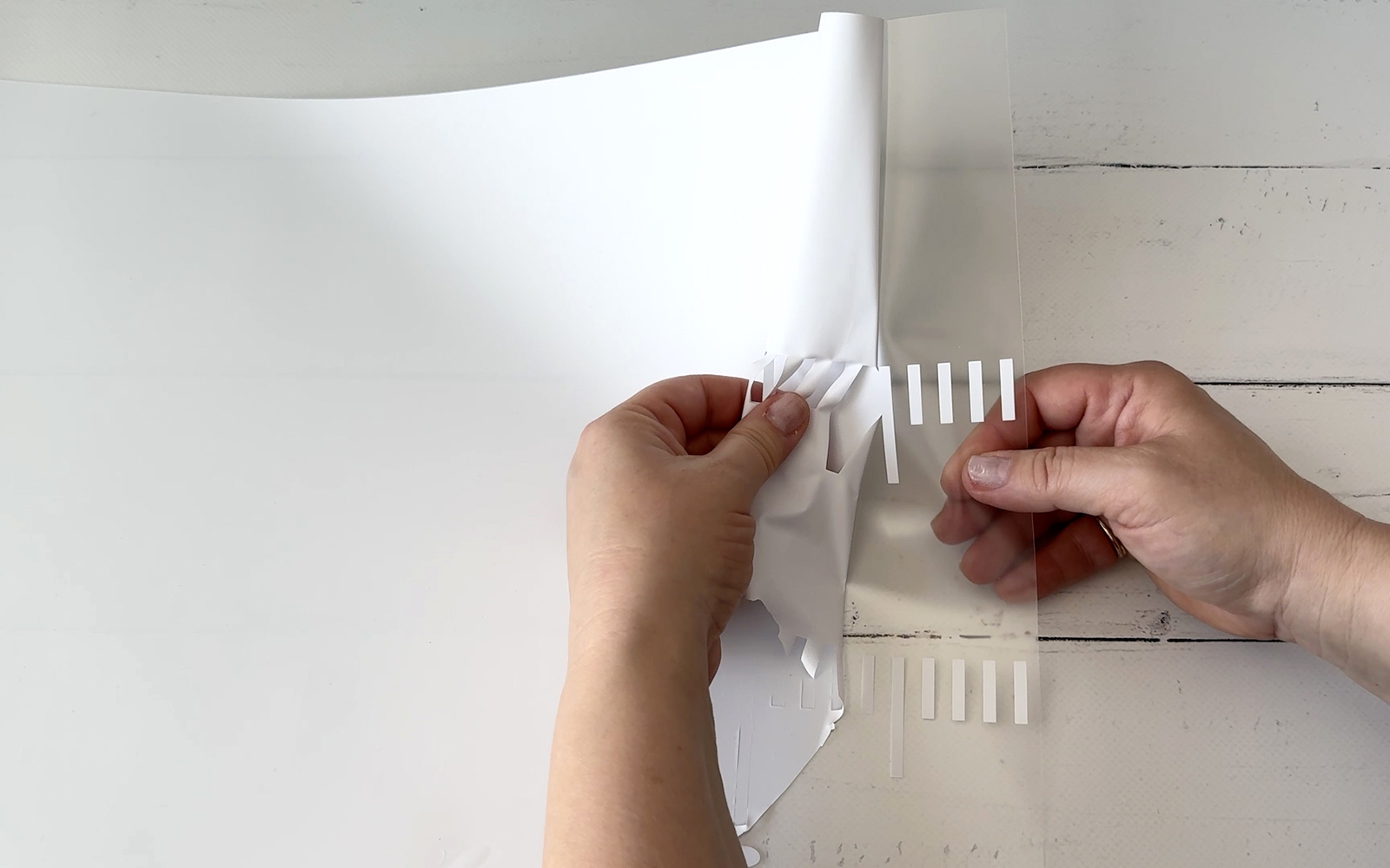 Weeding white heat transfer vinyl after cutting with ScanNCut