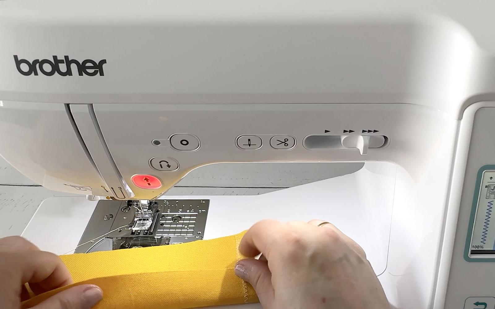 Sewing yellow fabric strip on Brother sewing machine