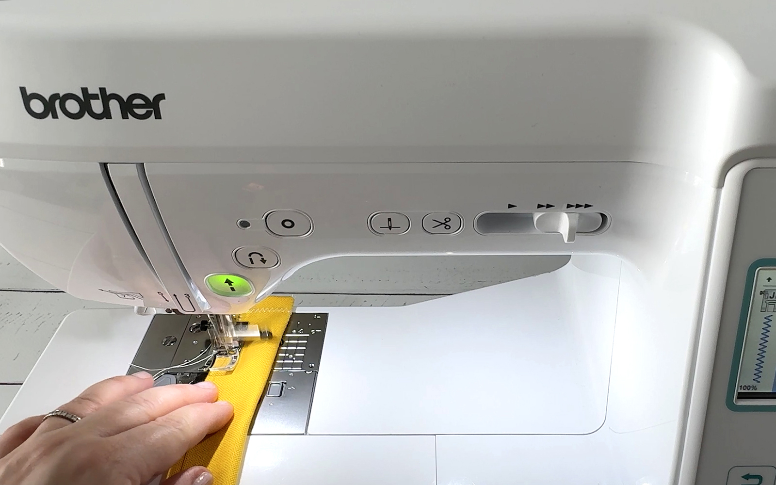 Sewing yellow fabric strip on Brother sewing machine
