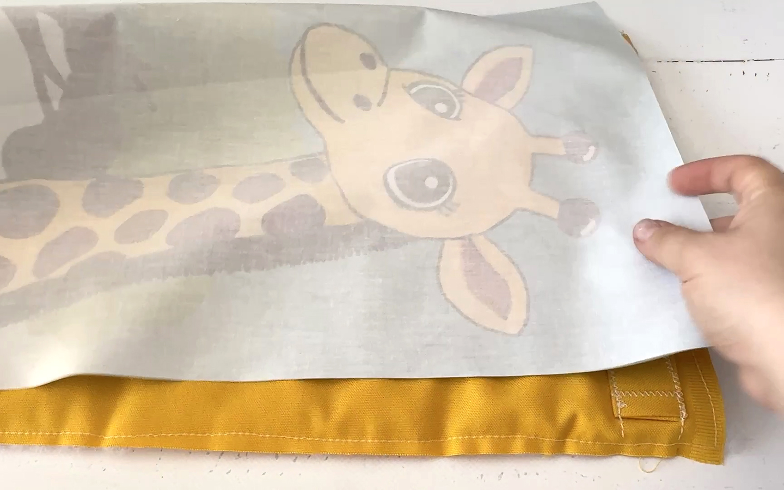Printed giraffe fabric and backing right sides facing.