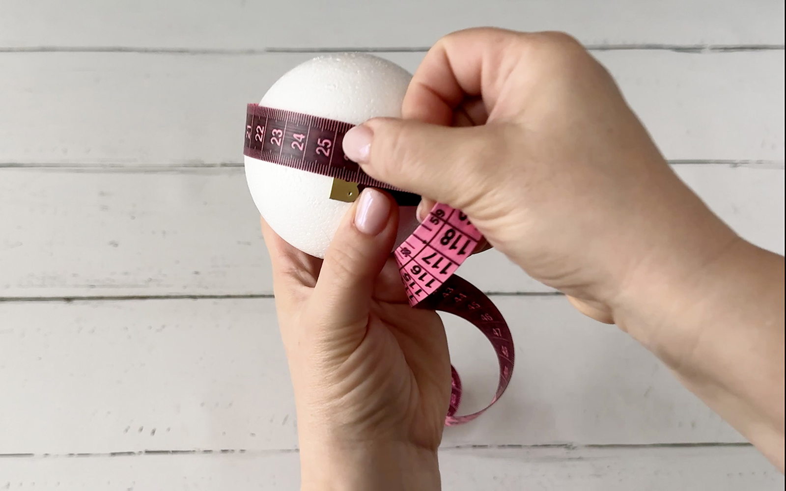 Measuring the circumference of a Styrofoam bauble