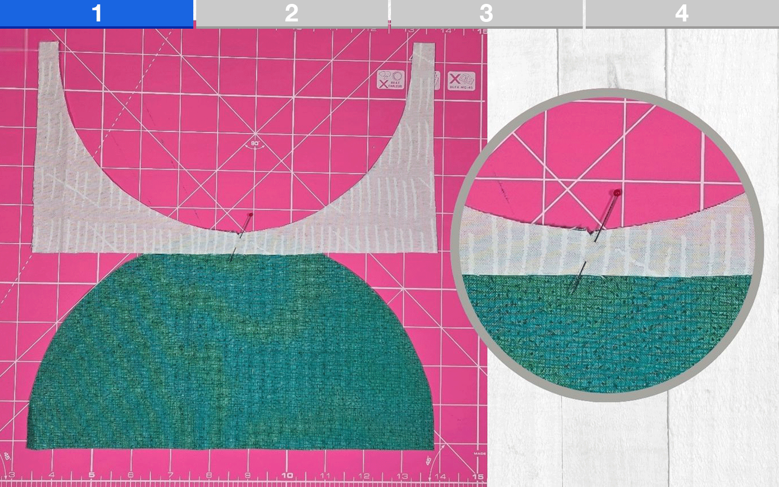 matching white and green quilt pieces with pin before sewing