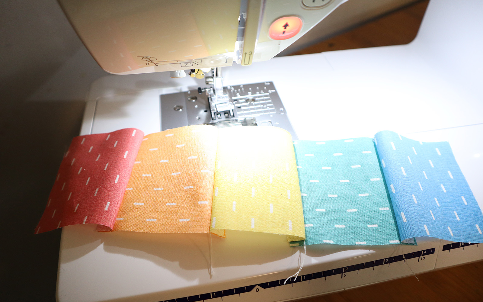 Strip of multicoloured squares sewn together