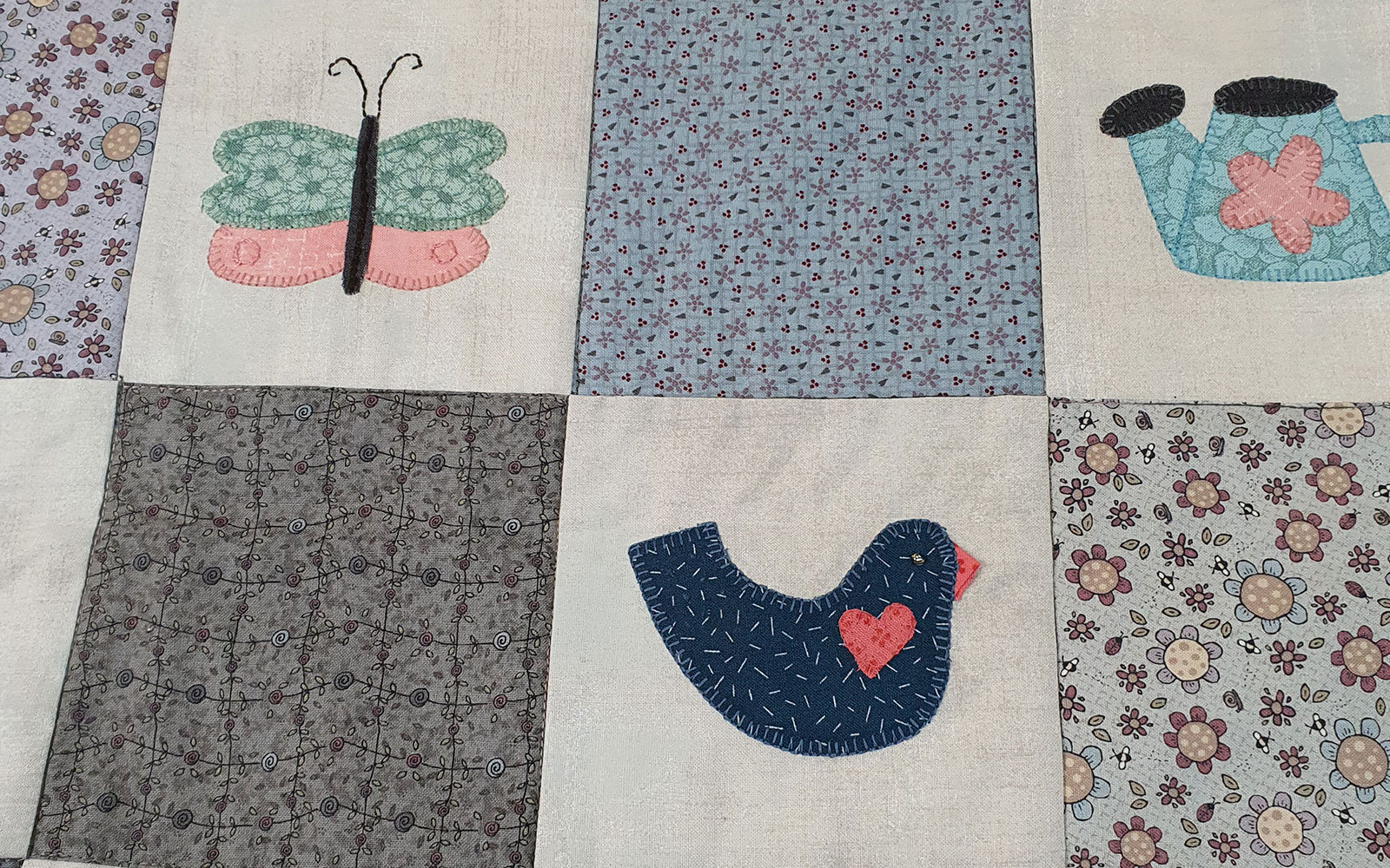 cream quilted tote bag with appliqué pink rabbit on front